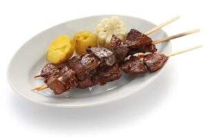 When visit Lima Peru top things to do in Lima with kids is try anticuchos